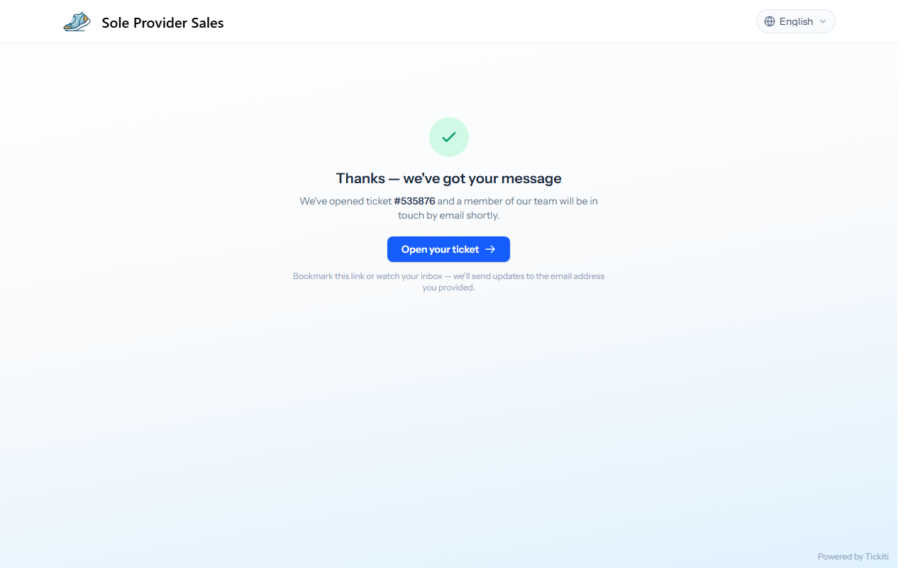 The confirmation: a green tick, the new ticket number, and an Open your ticket button